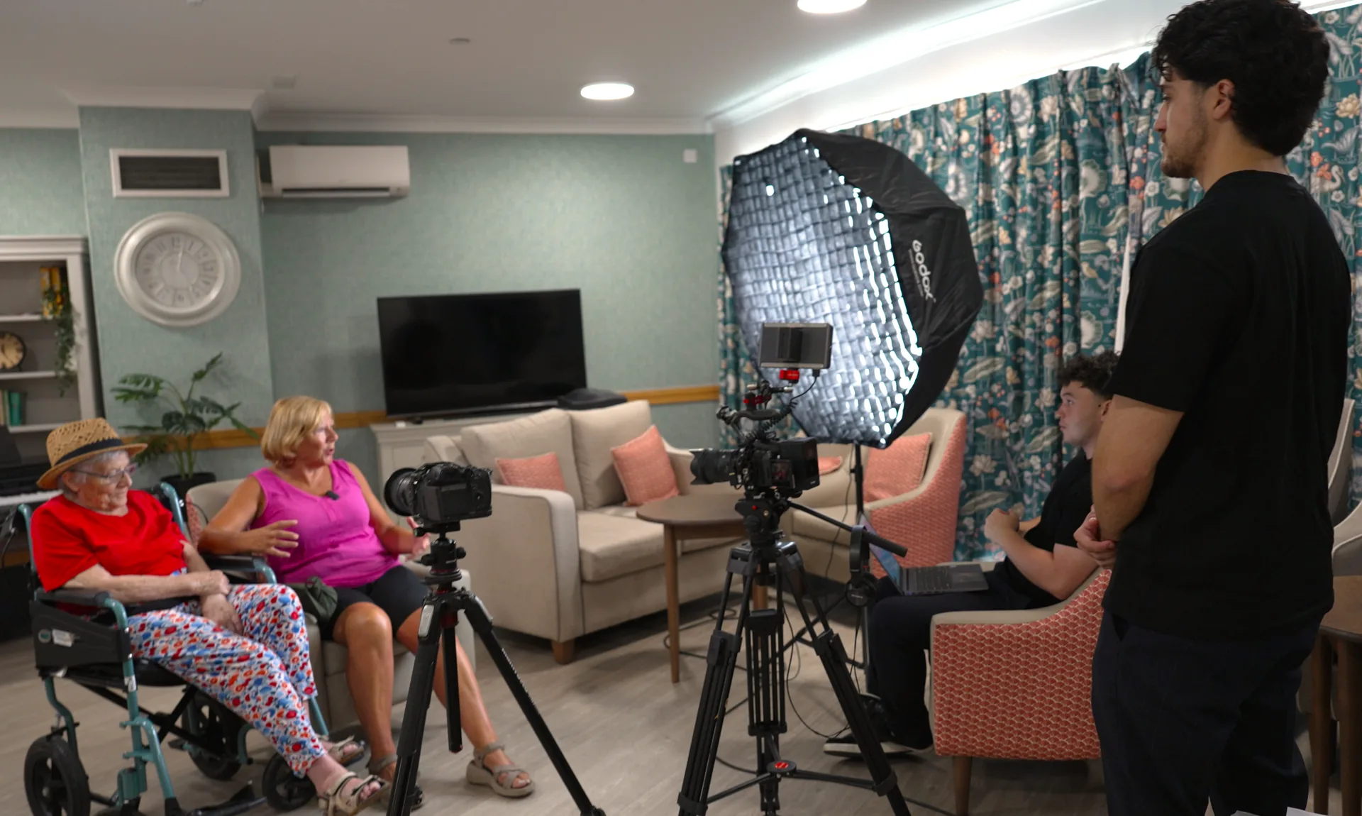 Behind the scenes, our crew filming a resident's story at the home.